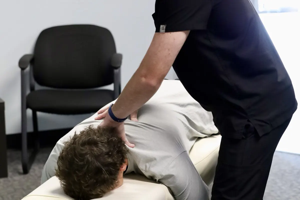 Dr. Frost checking neck and spine alignment