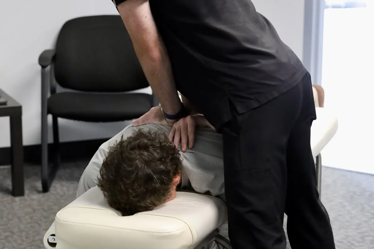 Dr. Frost performing a gentle nerve decompression adjustment