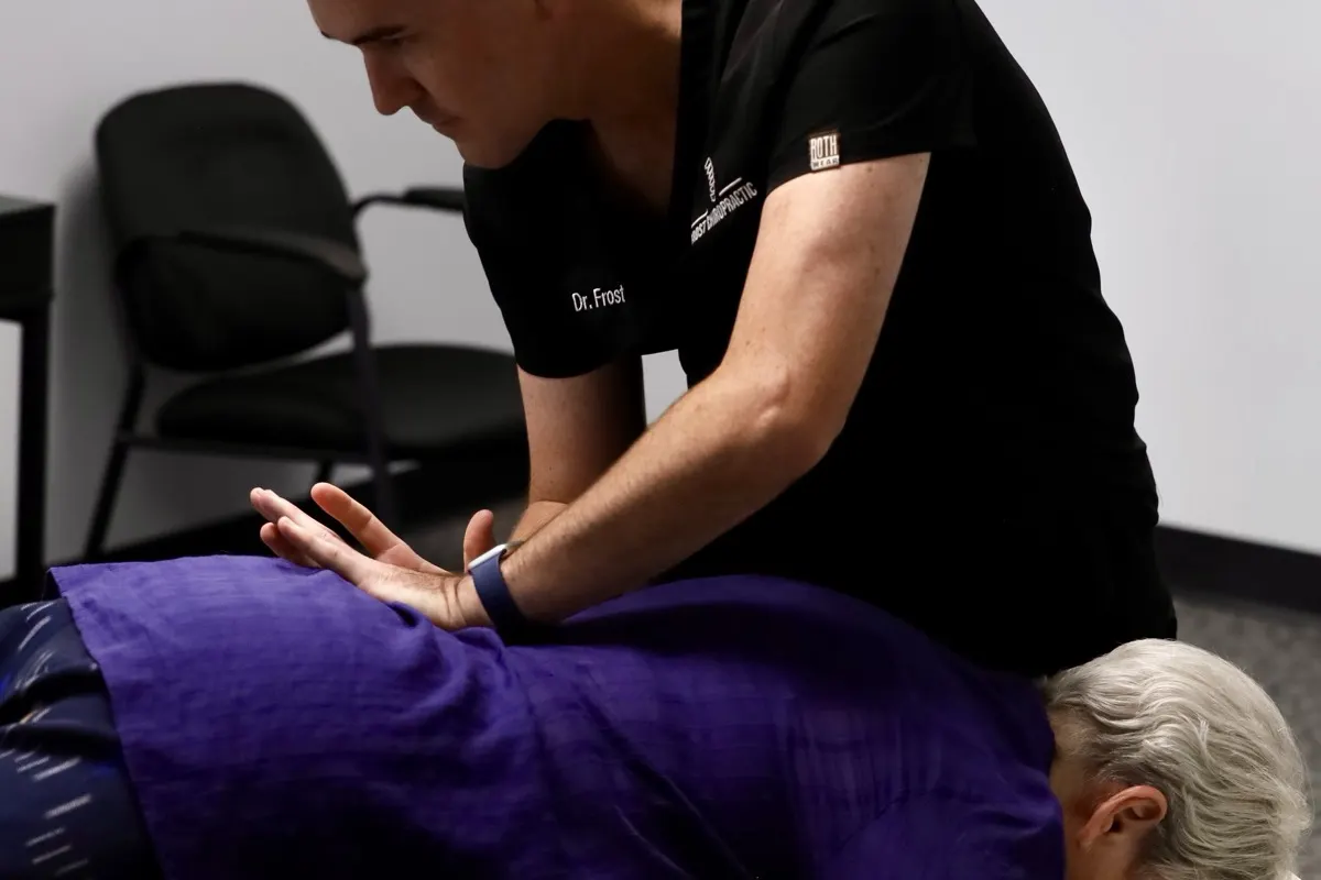Dr. Frost performing a gentle spinal adjustment