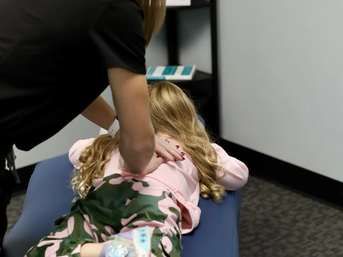 Gentle pediatric chiropractic adjustment for a child in Tulsa, Oklahoma